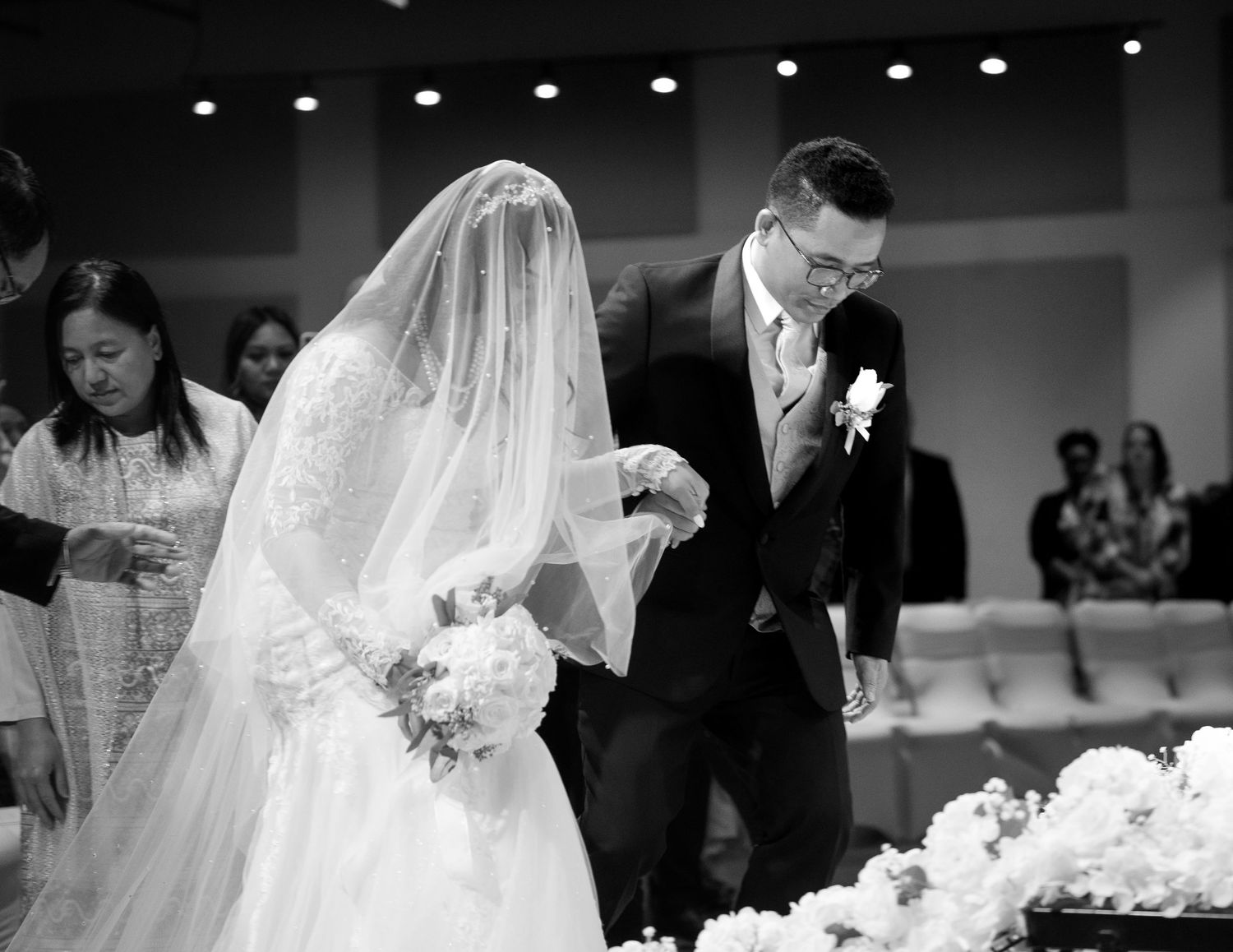Black and white wedding ceremony photos showing emotional moments.