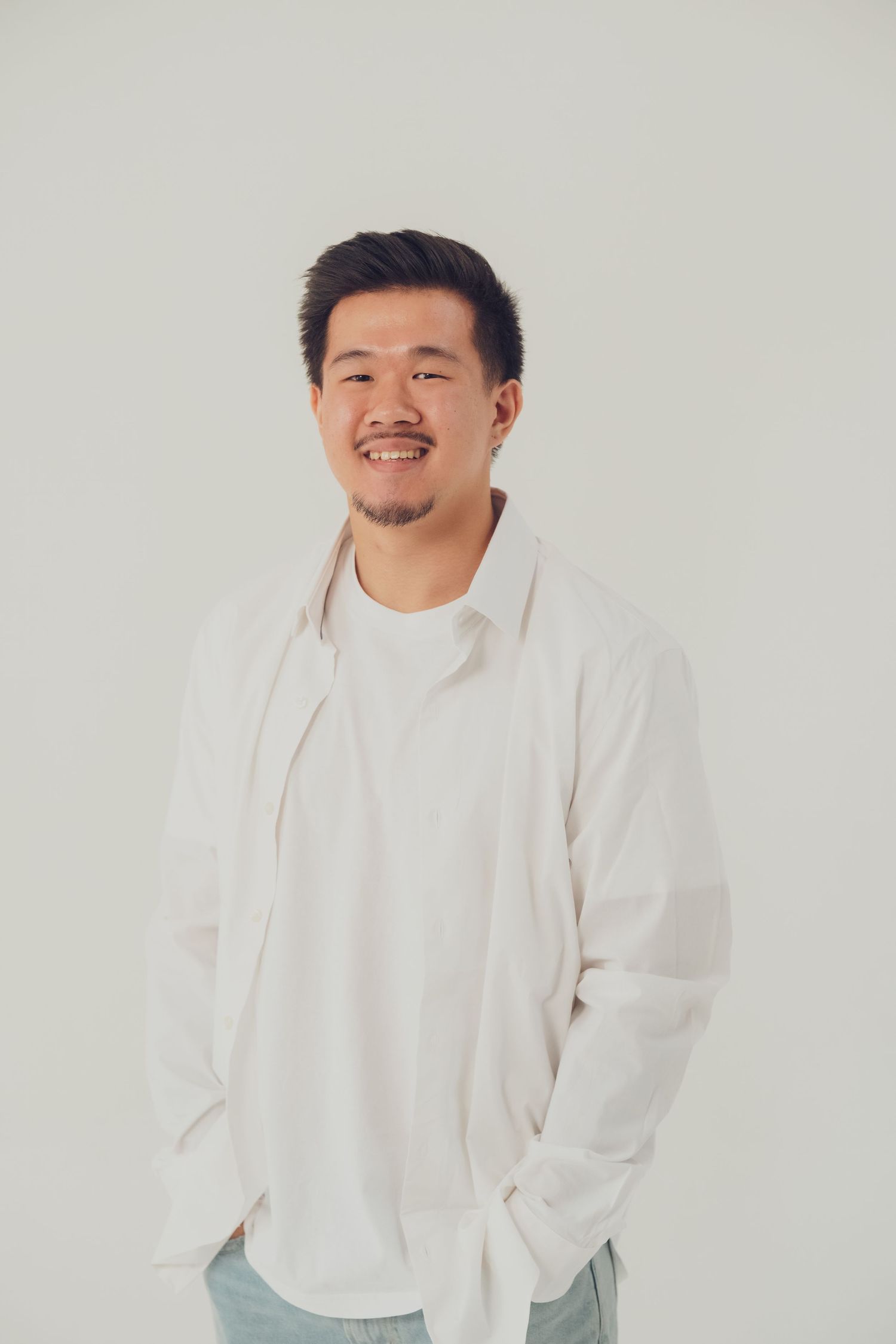 Casual studio portraits featuring a person in white clothing against a light background.