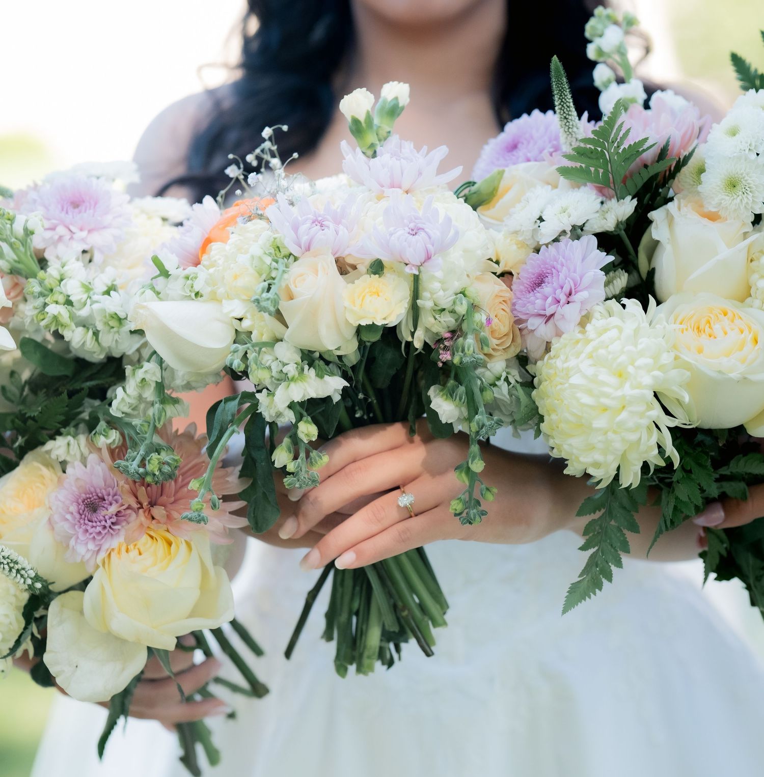 Soft pastel bouquets with peonies, roses and greenery arranged in a row.