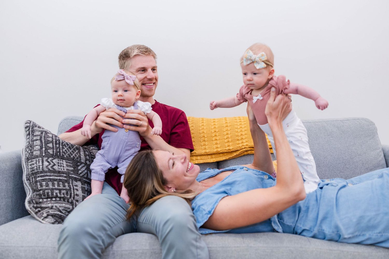 Mother holding her newborn in lifestyle session — Connecticut newborn photographer Minmo Photography