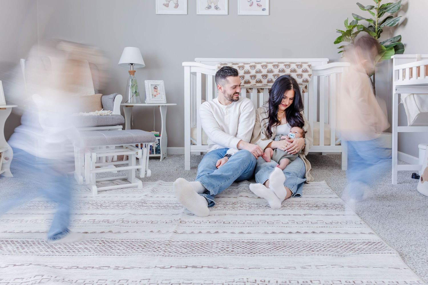 Parents cradling their newborn during a lifestyle newborn session in Connecticut — Minmo Photography