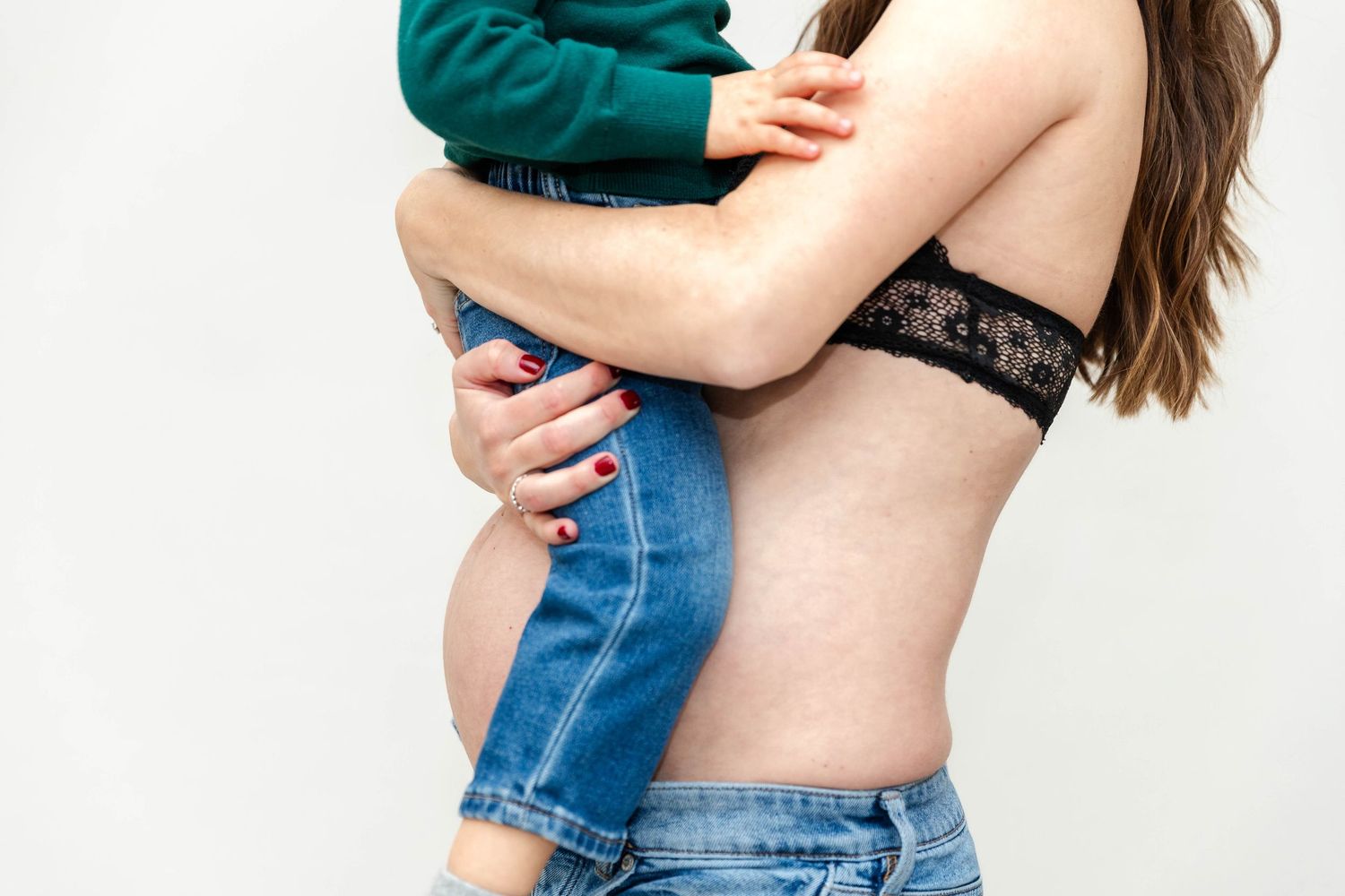 Close-up of pregnant belly and toddler during a Connecticut maternity session — Minmo Photography