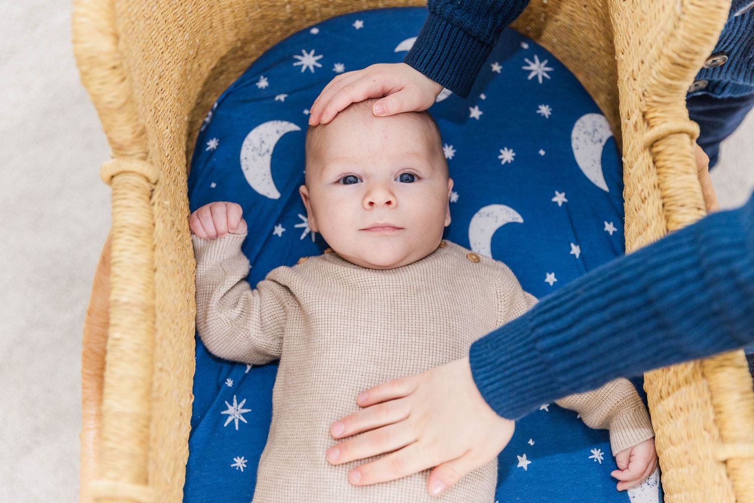Newborn baby in a basket during a Connecticut lifestyle newborn session — Minmo Photography