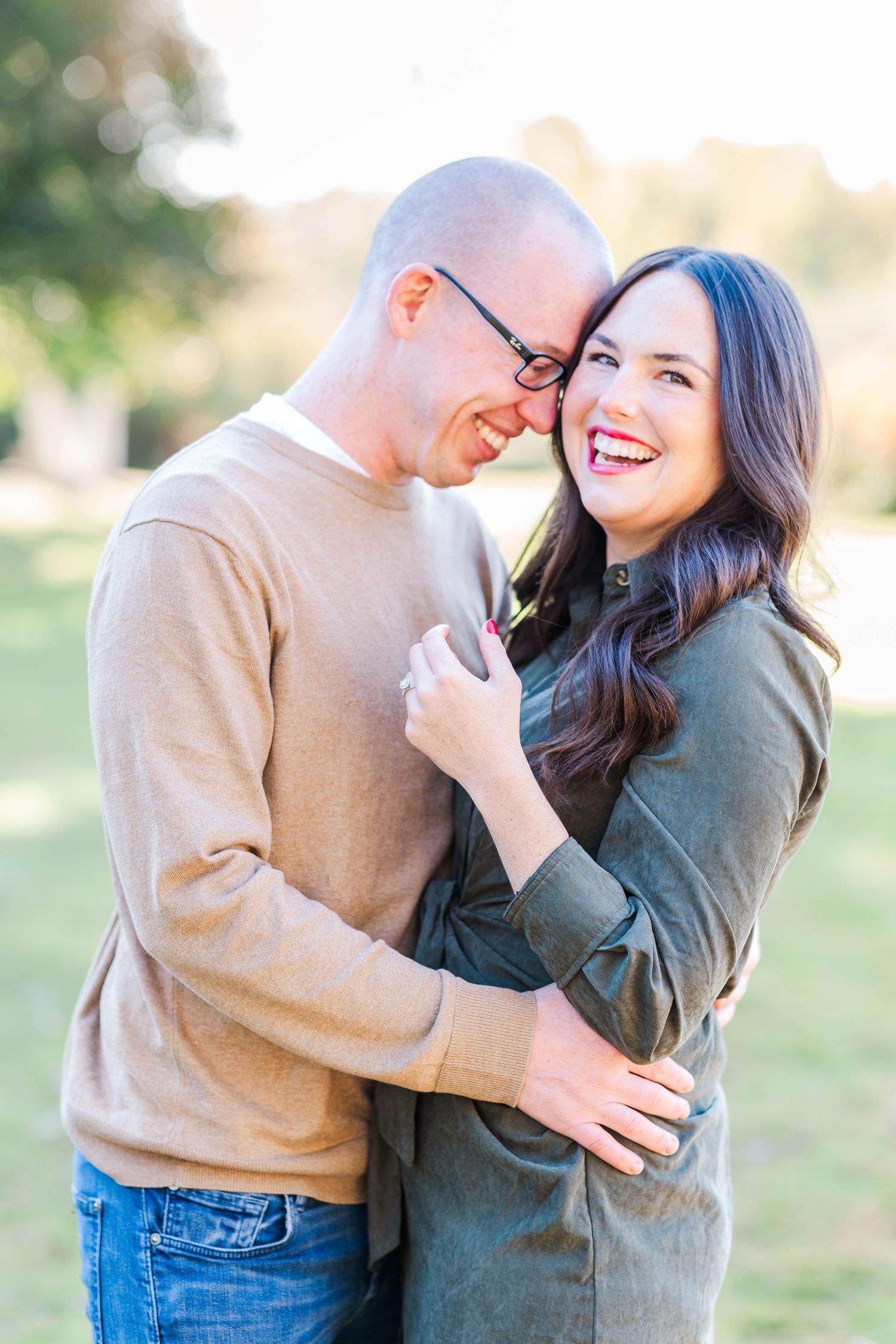 Couple embracing and laughing during a Connecticut photography session outdoors — Minmo Photography