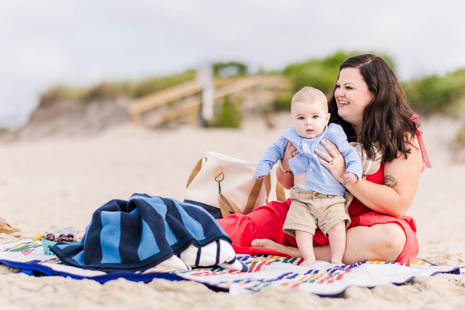 Mom and baby sitting together on a blanket at the beach during a Connecticut outdoor session — Minmo Photography