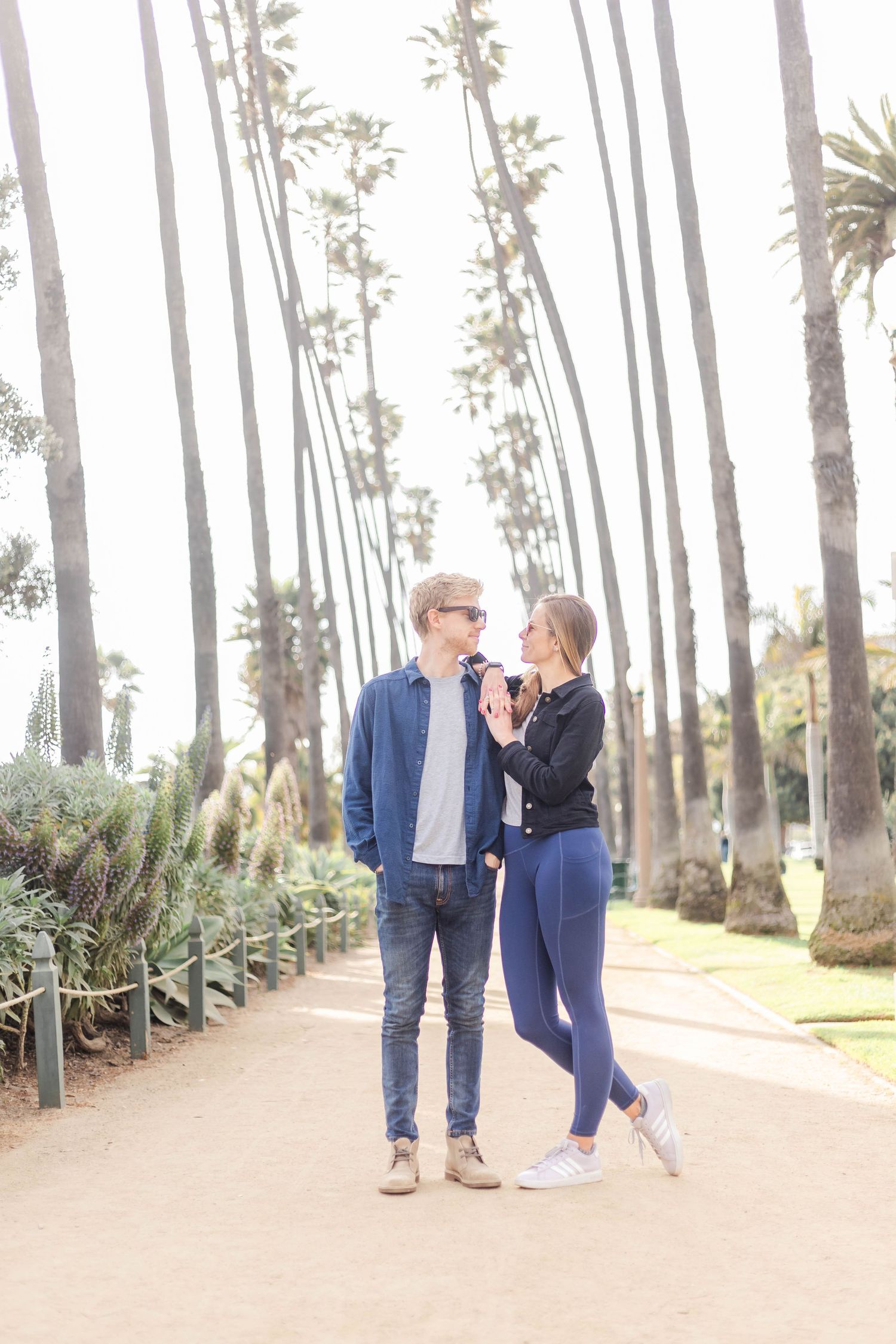 Couple laughing together during a golden hour engagement session in Los Angeles — Minmo Photography