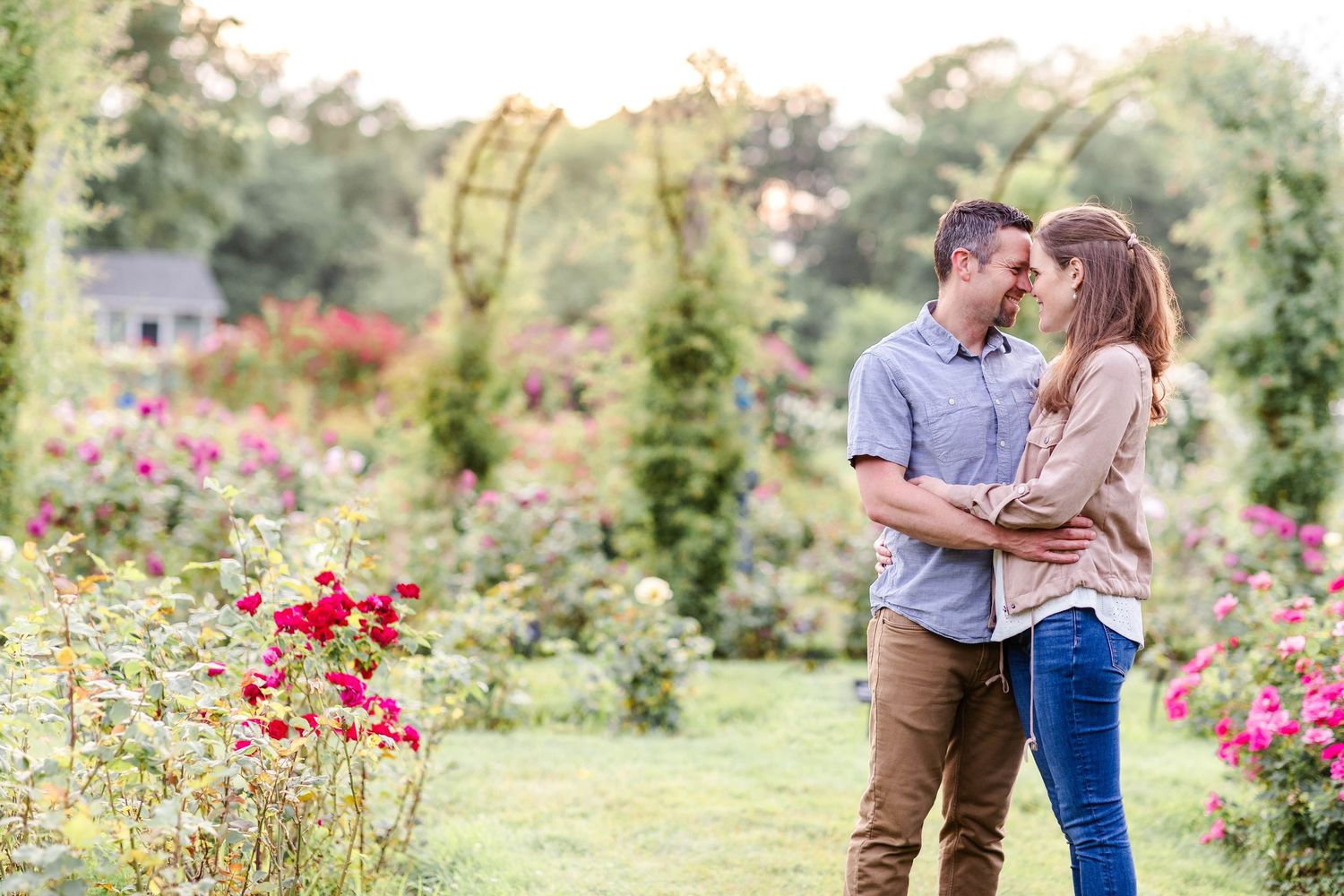 Couple embracing in a Connecticut park during a relaxed family session — Minmo Photography
