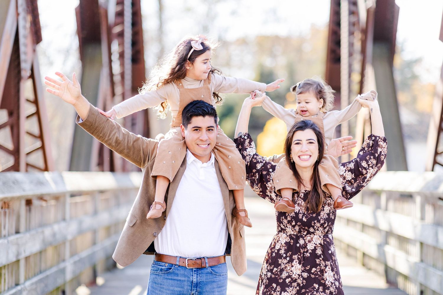 Mom and Dad with kids on their shoulders during an outdoor session in Farmington Valley -- Minmo Photography