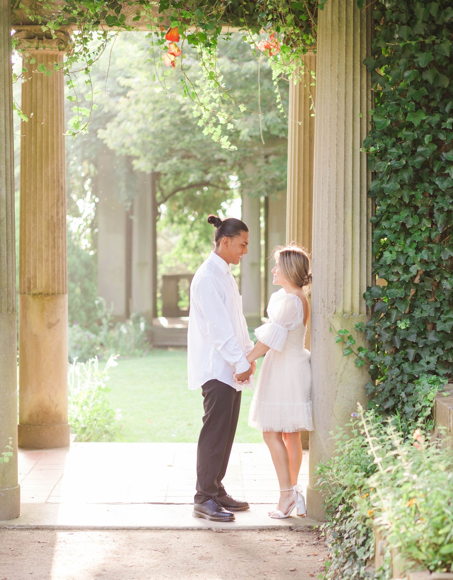Couple holding hands during a golden hour engagement session in Connecticut — Minmo Photography