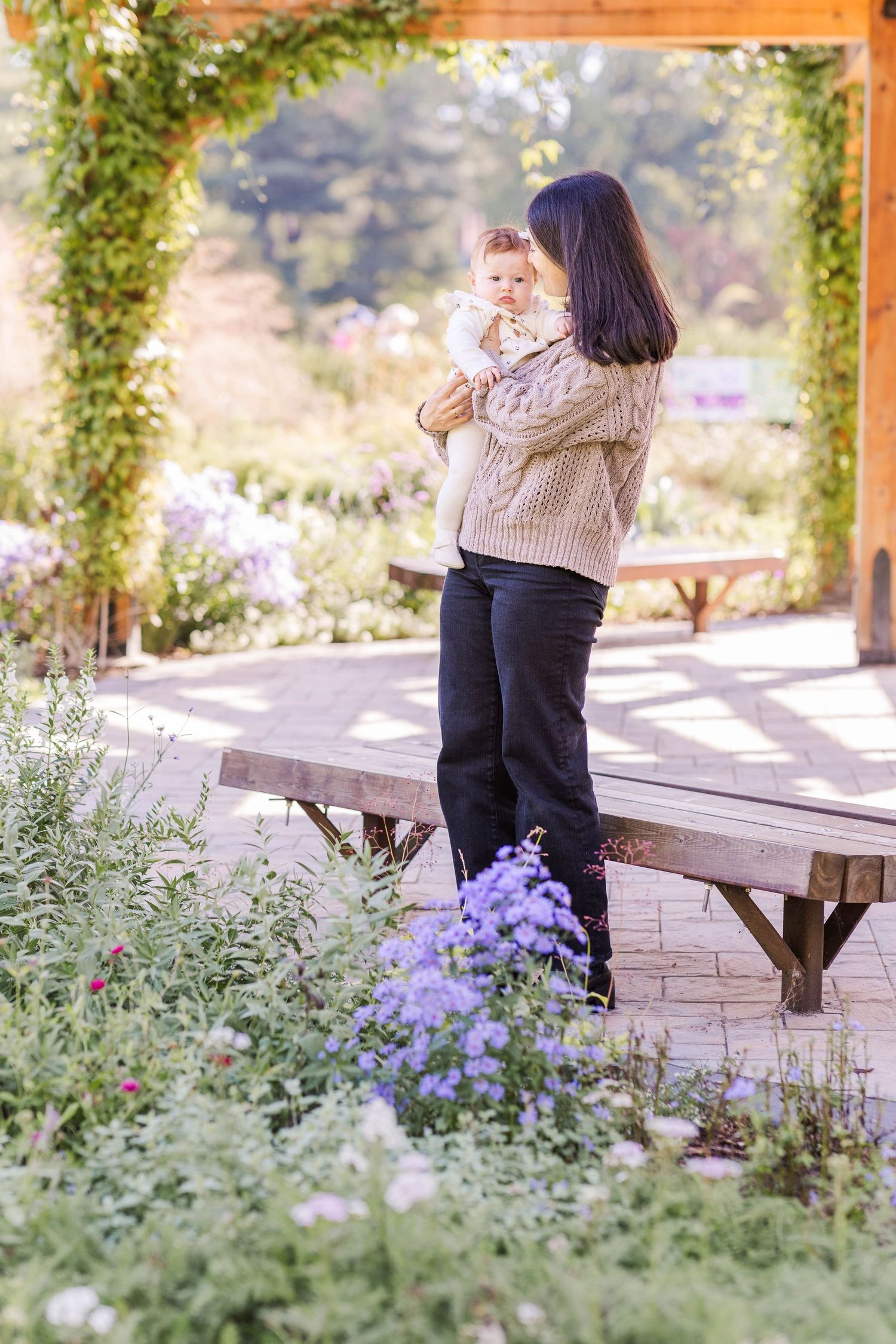 Mother holding her newborn in natural light at Elizabeth Park — Connecticut newborn photographer Minmo Photography