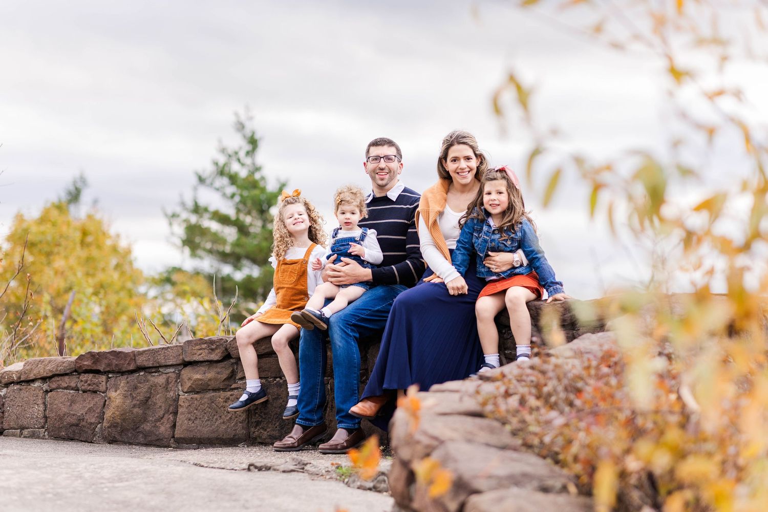 Family of five hugging at the Talcott Mountain overlook during a fall family session — Minmo Photography