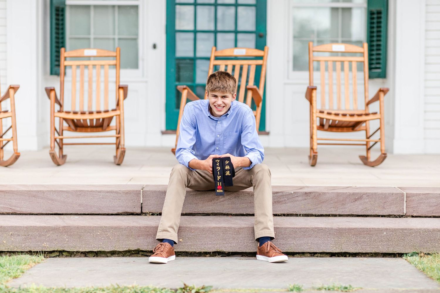 High school senior portrait with meaningful prop taken outdoors in Connecticut — Minmo Photography