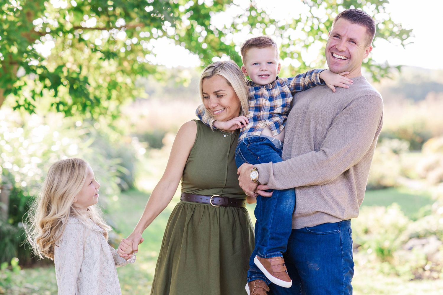 Family laughing together during a Connecticut portrait session — Minmo Photography