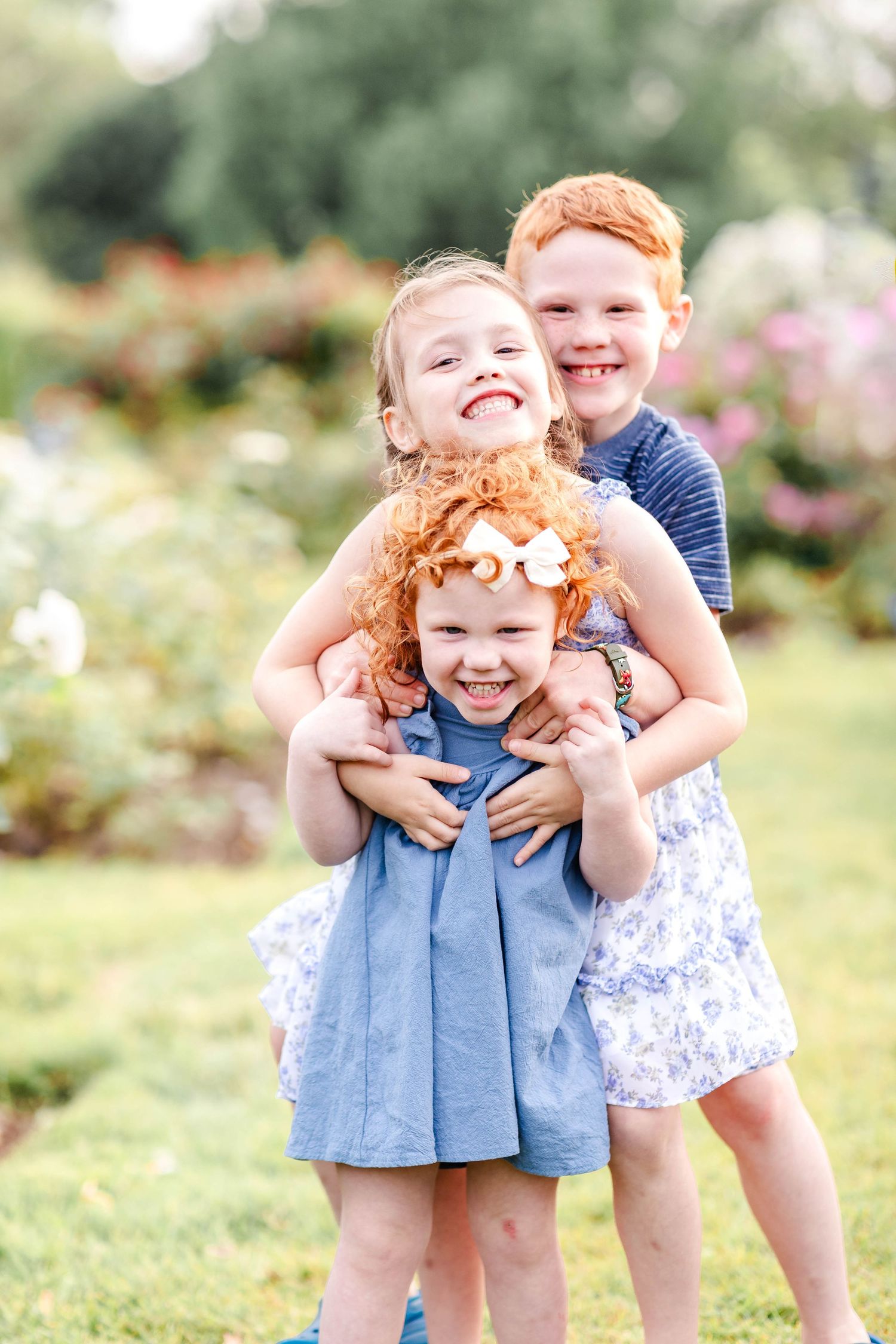 Portrait of three siblings during fun and candid family session -- Minmo Photography