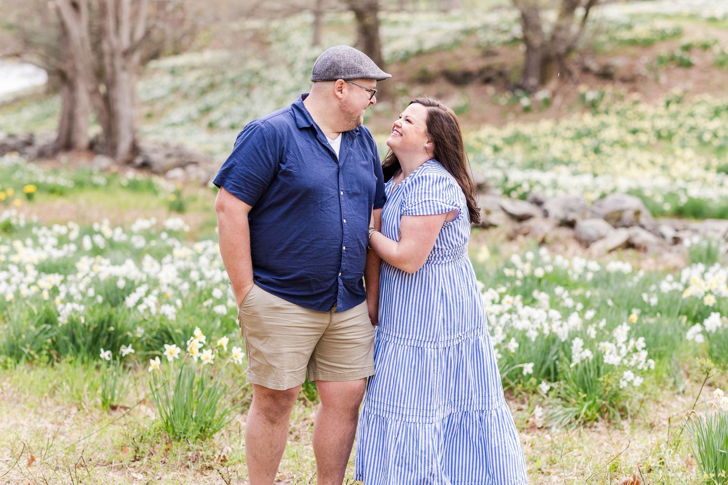 Couple laughing together during a golden hour family session in Connecticut — Minmo Photography
