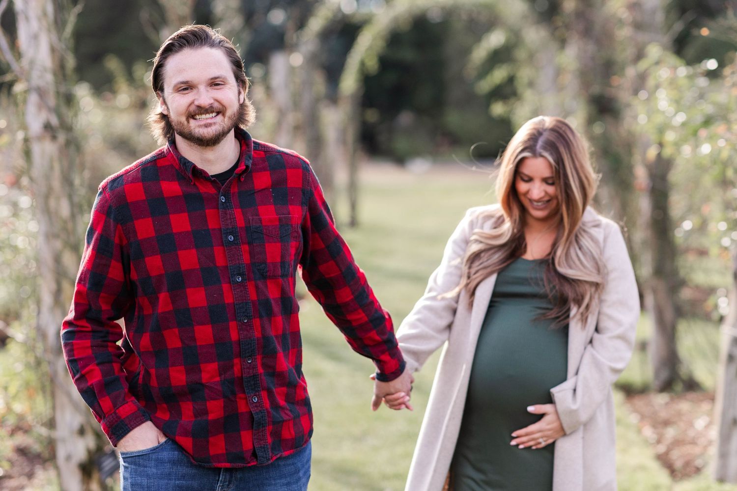 Two people holding hands during a Connecticut couples maternity session — Minmo Photography