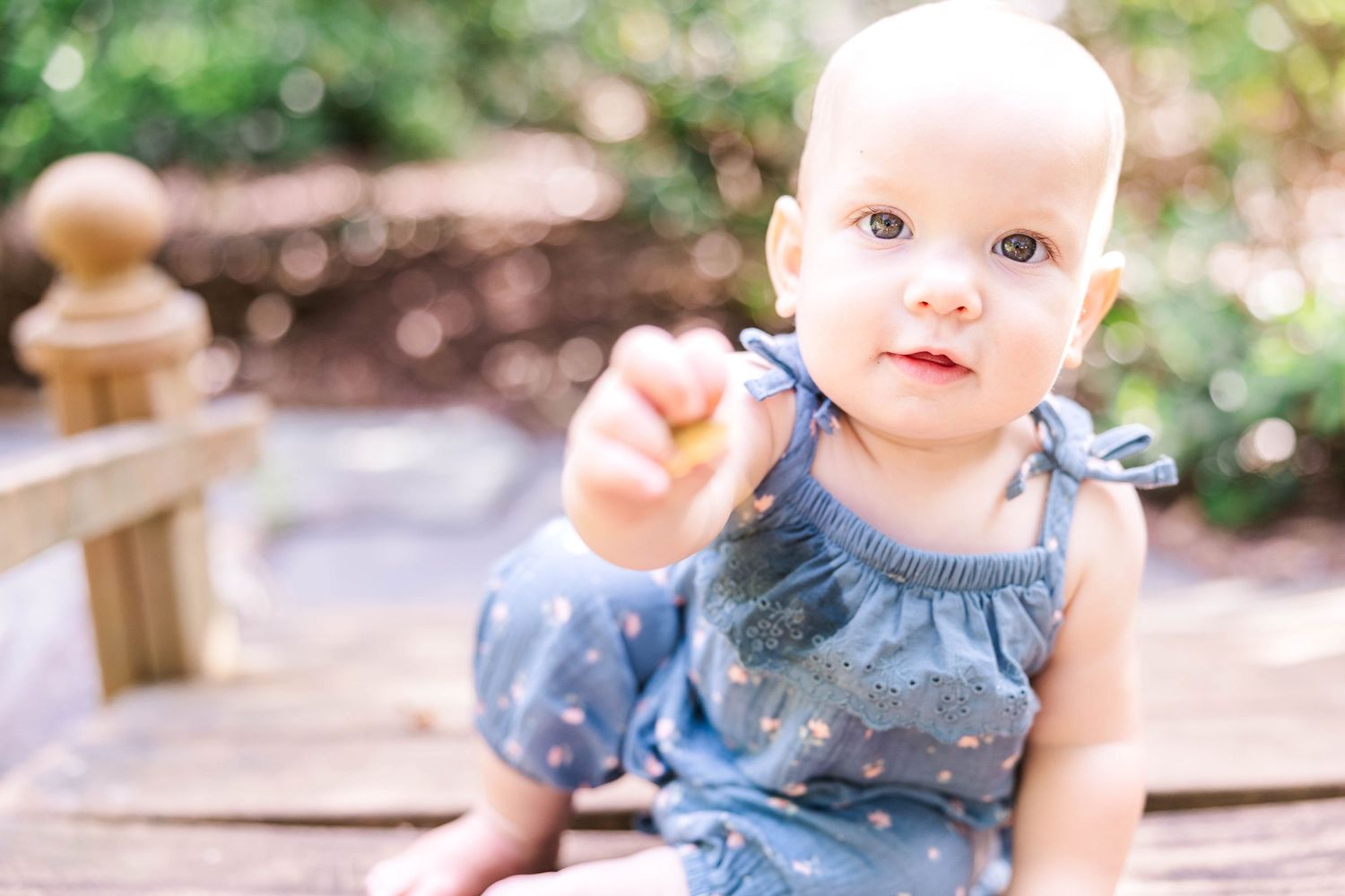 Close-up of a child looking at the camera during a Connecticut family portrait session — Minmo Photography