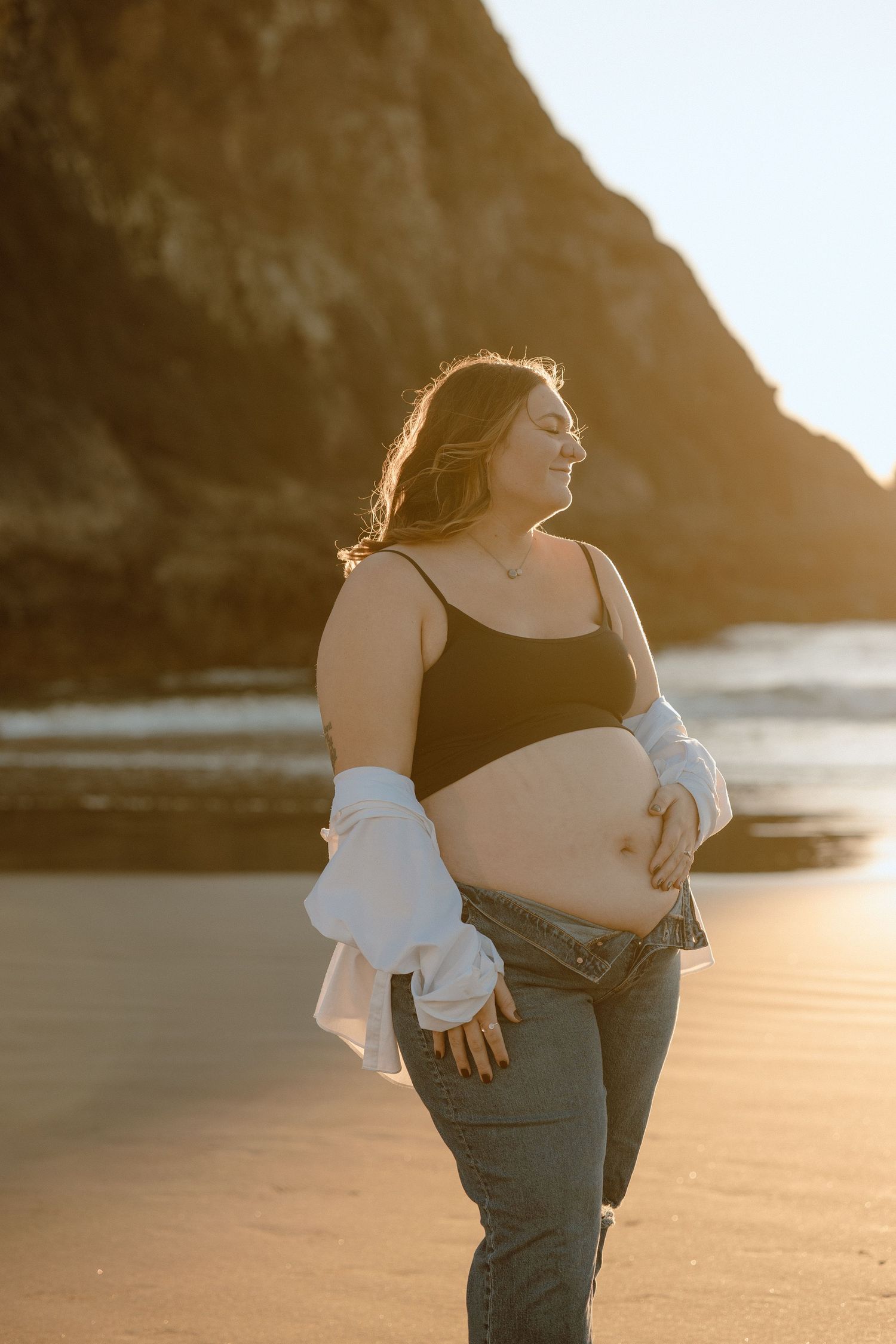 Pregnant mother in a maternity session photo at the oregon coast