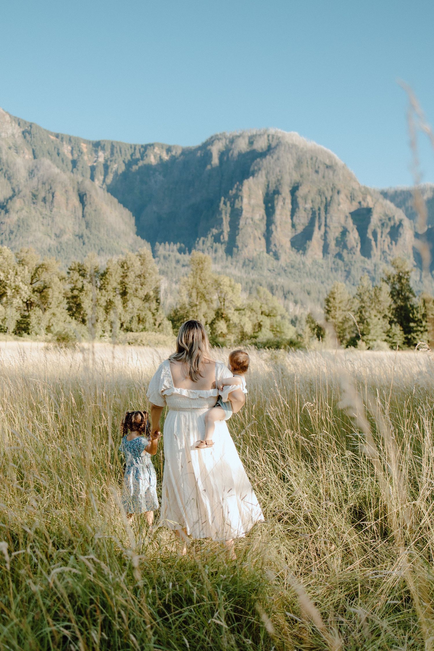 Family motherhood photo of a mom and two kids with a gorgeous PNW background