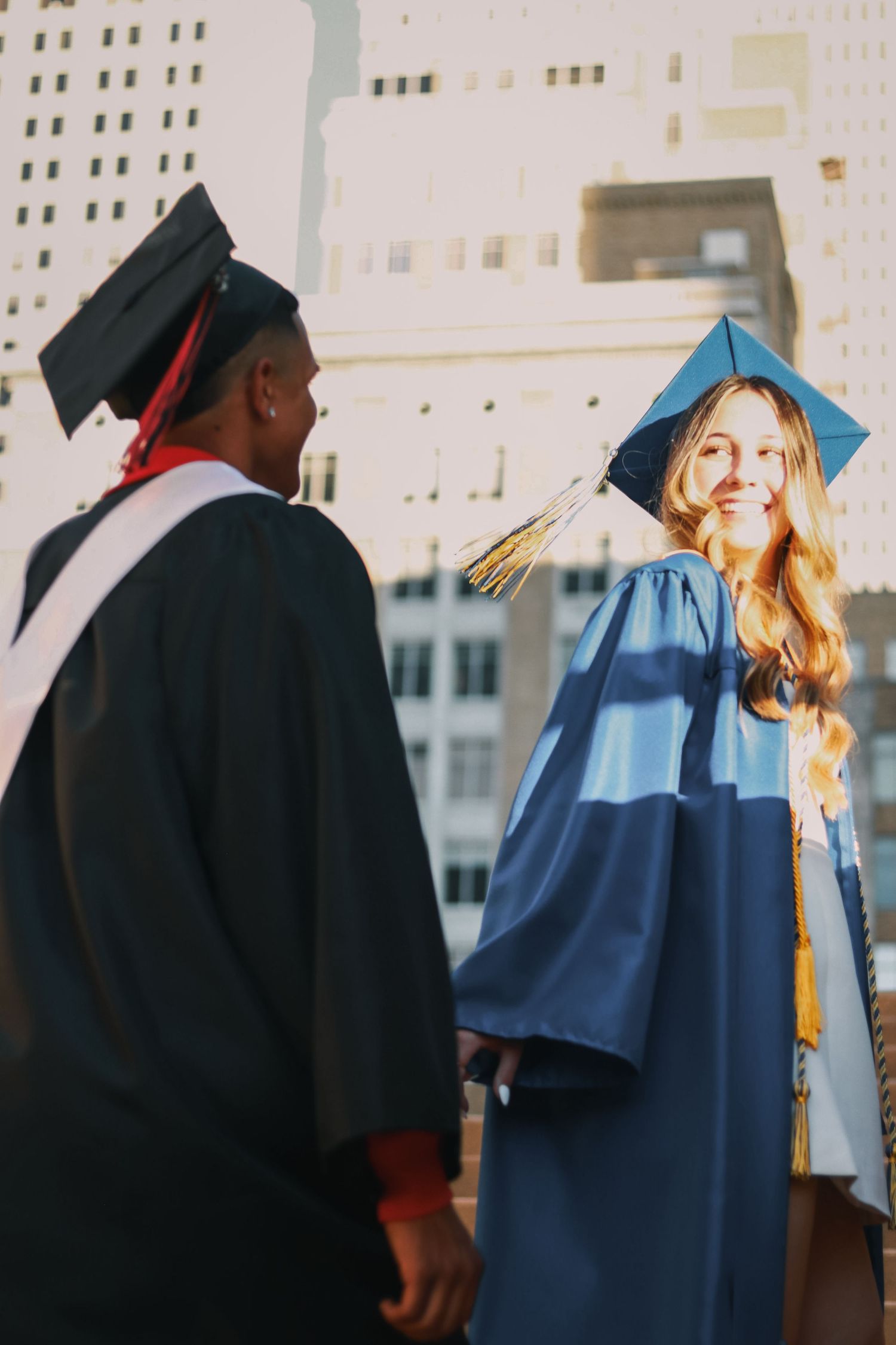 A sequence of graduation photos showing graduates in caps and gowns walking across a stage during commencement ceremony.