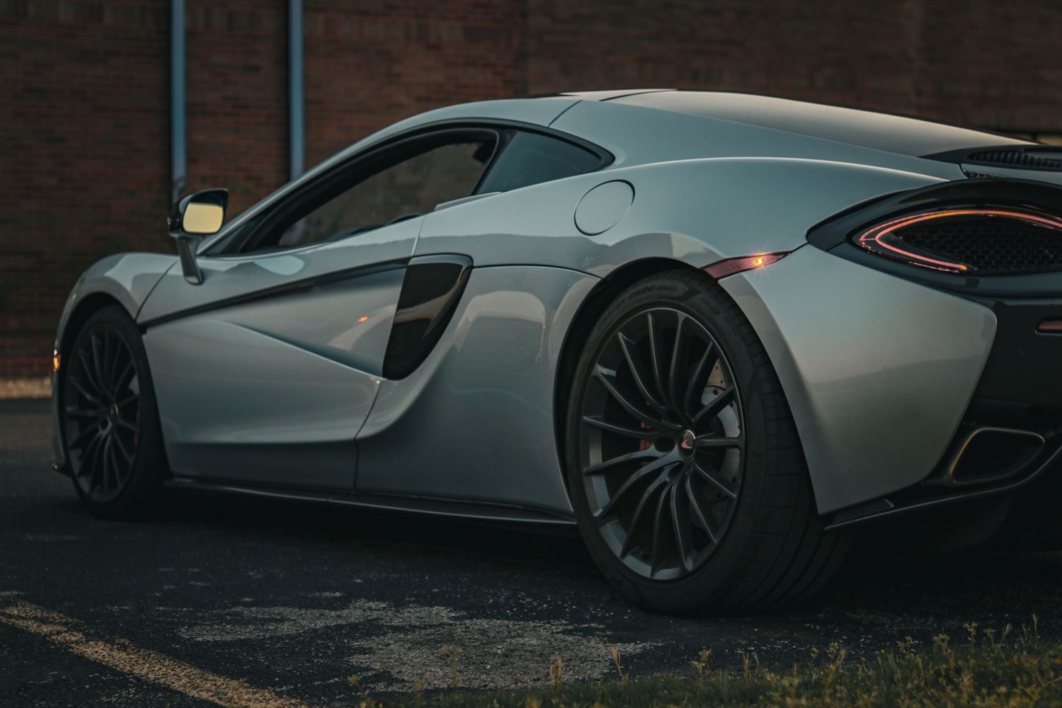Side profile shots of modern supercars showcasing aerodynamic design elements.