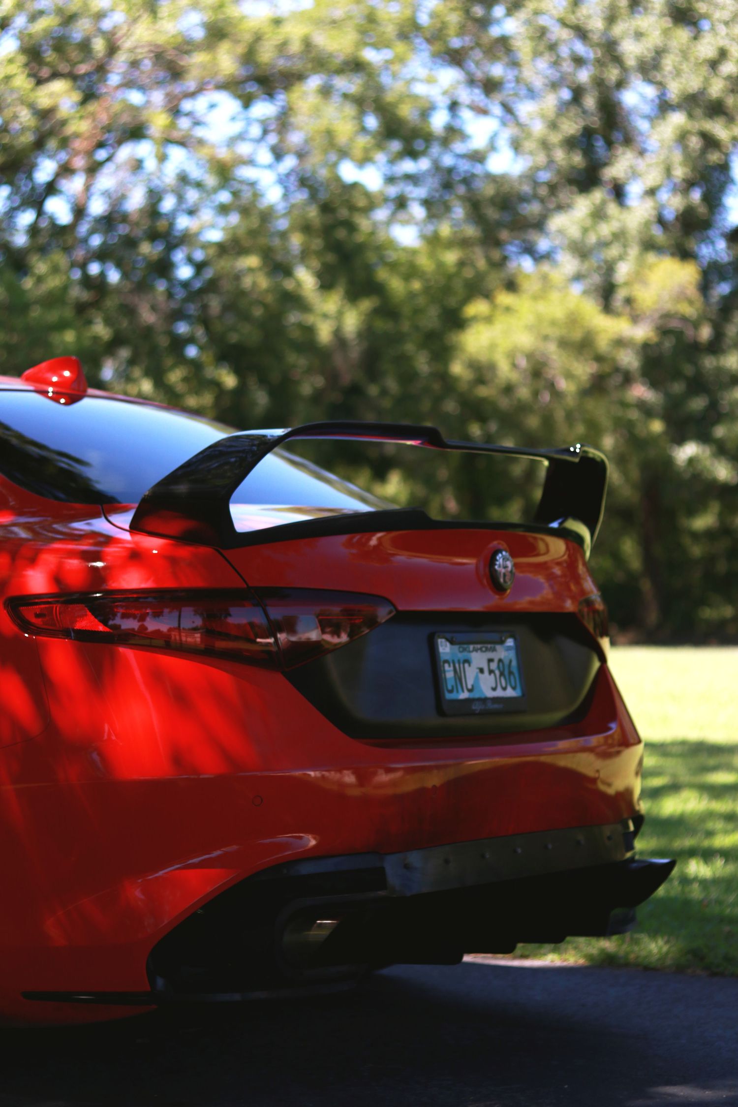 Side profile views of a red Ferrari showing its sleek aerodynamic design.