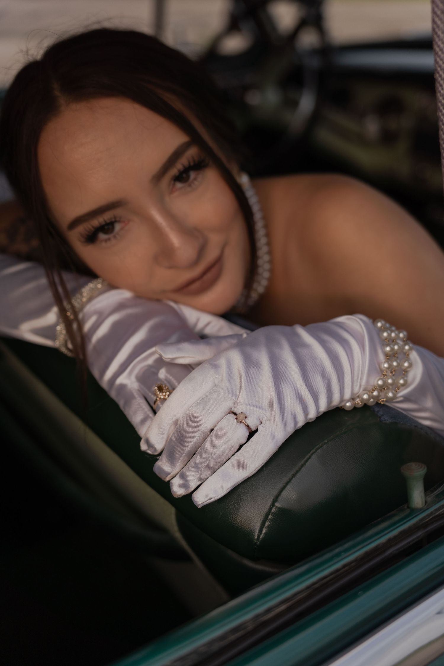 Cinematic shot of a bride driving a vintage car in Belle River Minnesota
