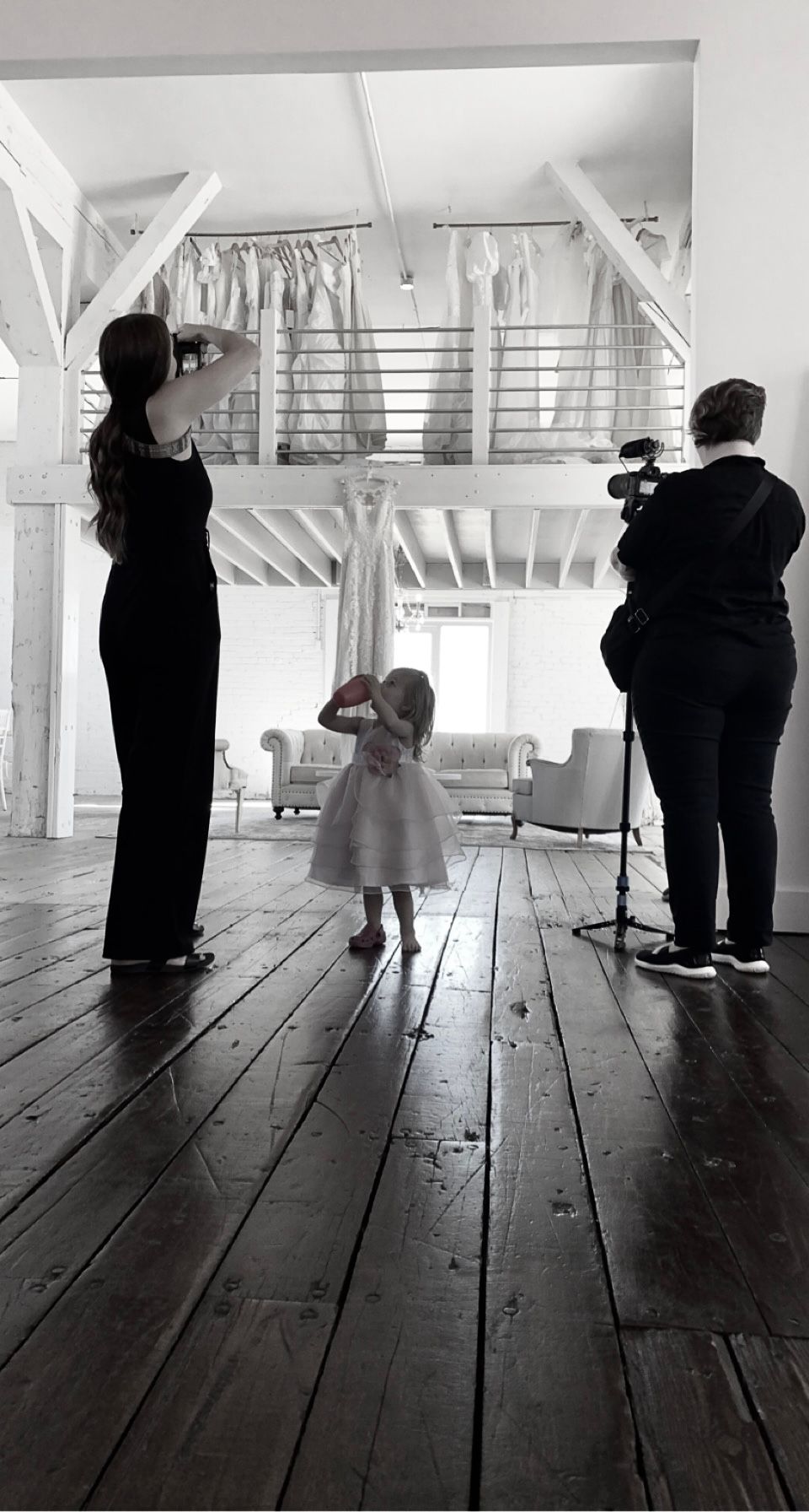 Little girl looking up at the bridal party dresses at Northern Pacific Center in Brainerd Minnesota