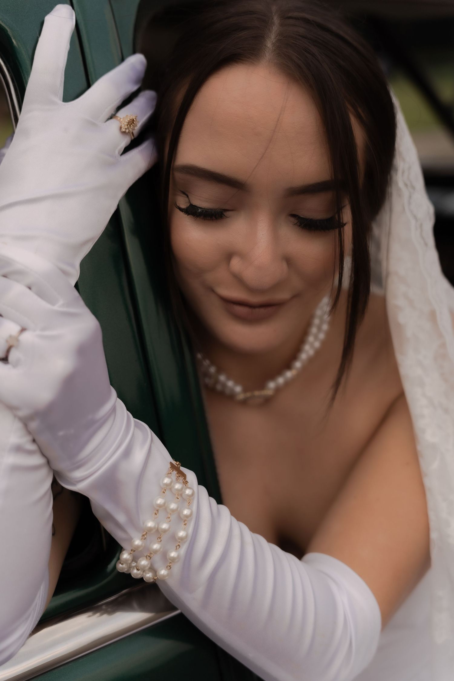 Cinematic shot of a bride driving a vintage car in Belle River Minnesota