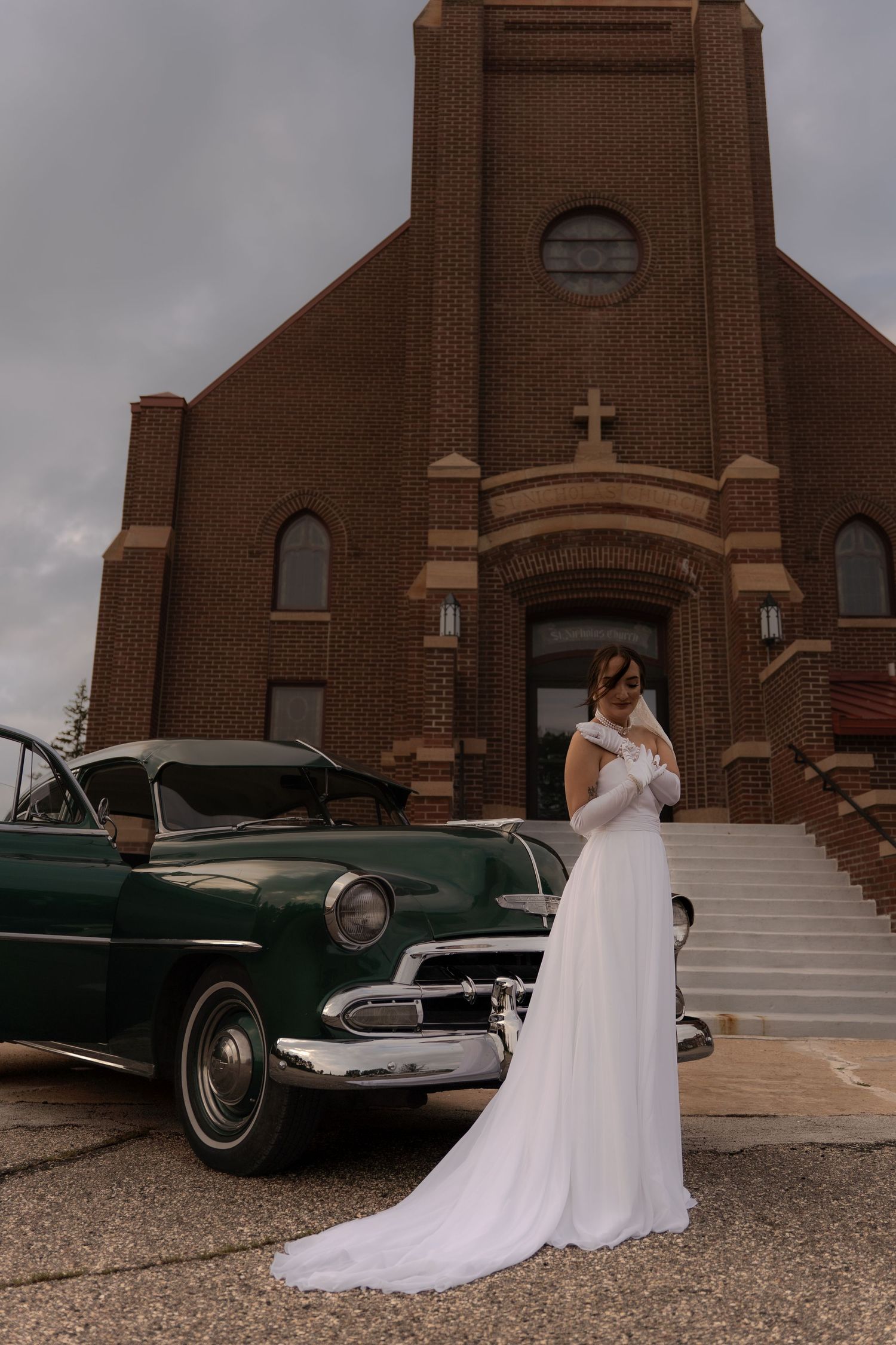 Bride shot next to vintage car in Belle River Minnesota