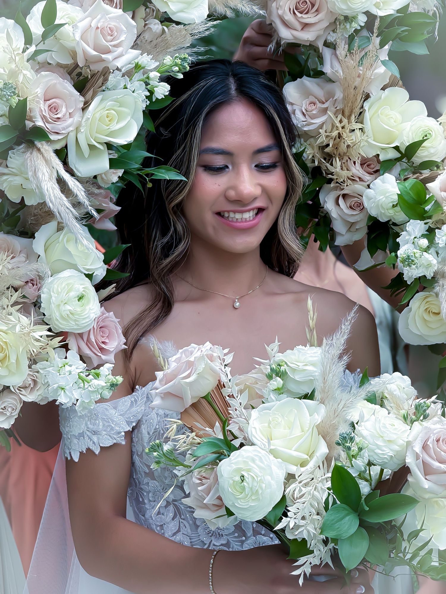 Up close photo of a bride and her bridesmaid flowers