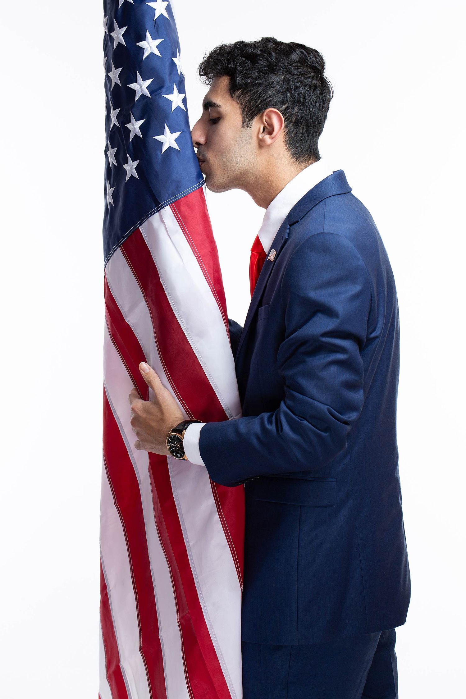 Series showing person in blue suit interacting with American flag against white background.
