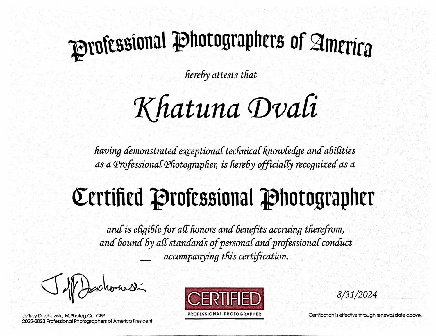 Professional photography certification diplomas and credentials laid out on white background.