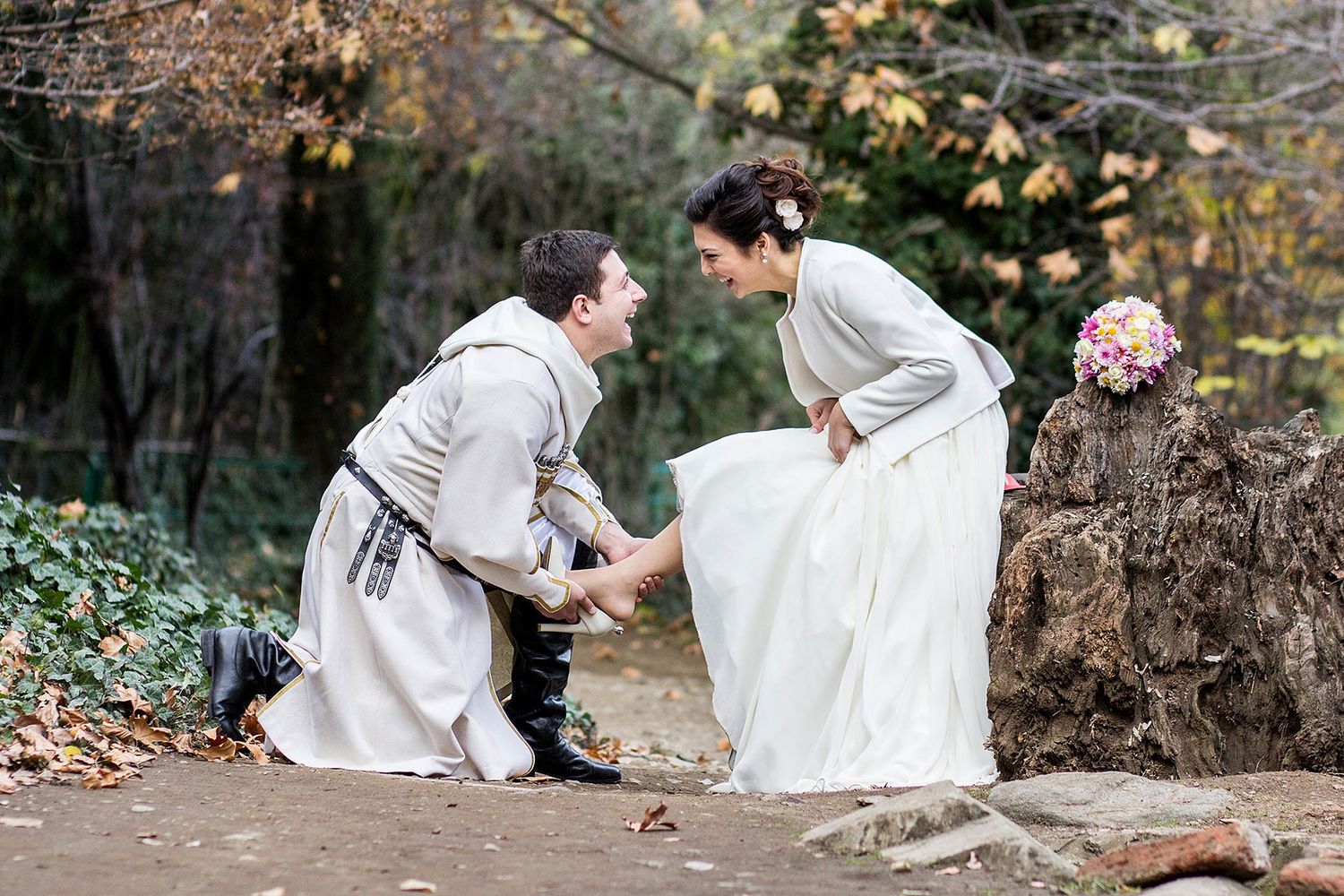 A romantic countryside proposal scene with medieval-style costumes.