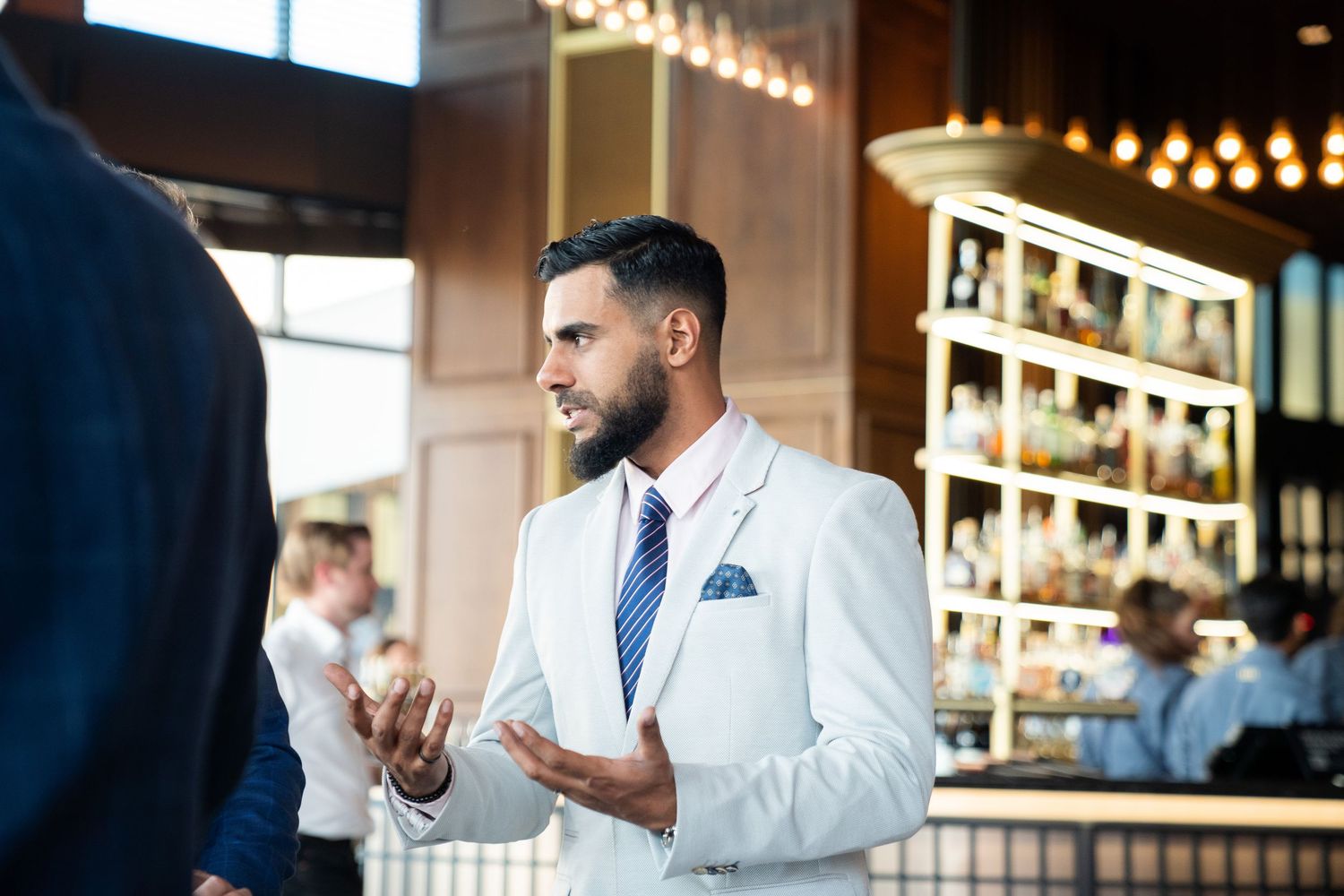 Event photographer capturing candid moments at a business conference