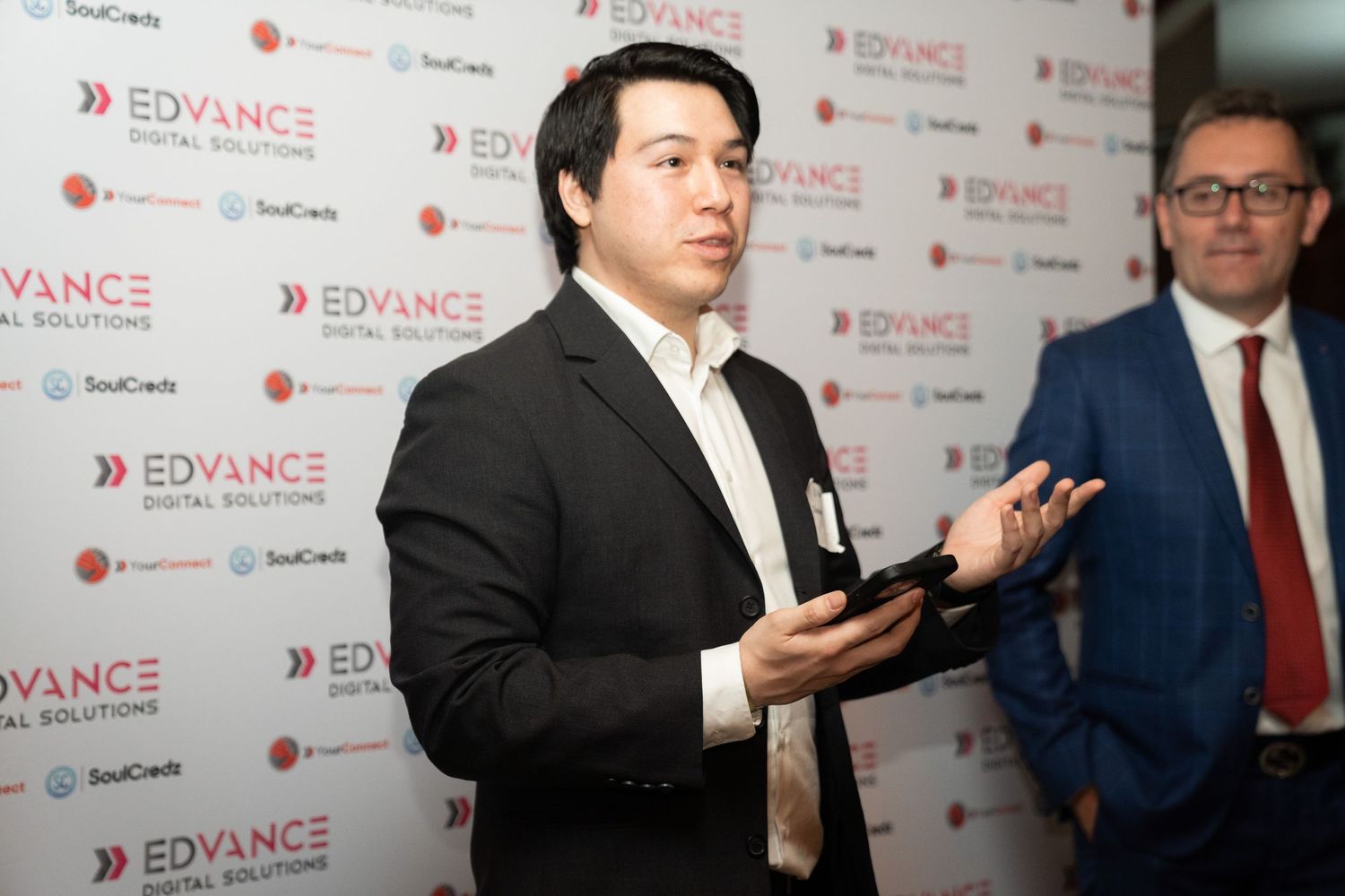 Event photographer capturing candid moments at a business conference