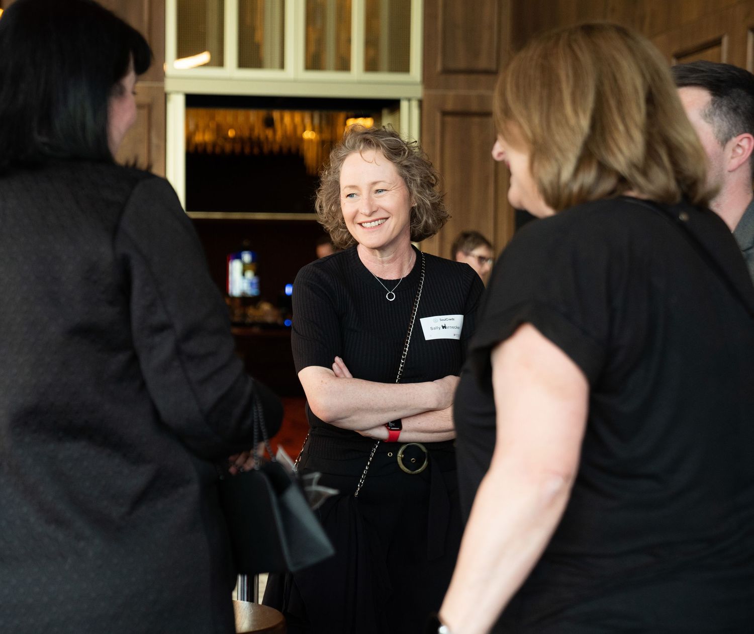 Event photographer capturing candid moments at a business conference