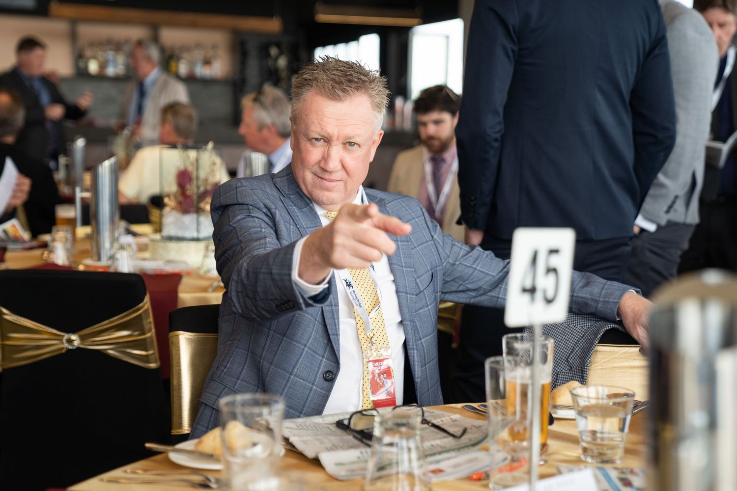 Event photographer capturing candid moments at a business conference