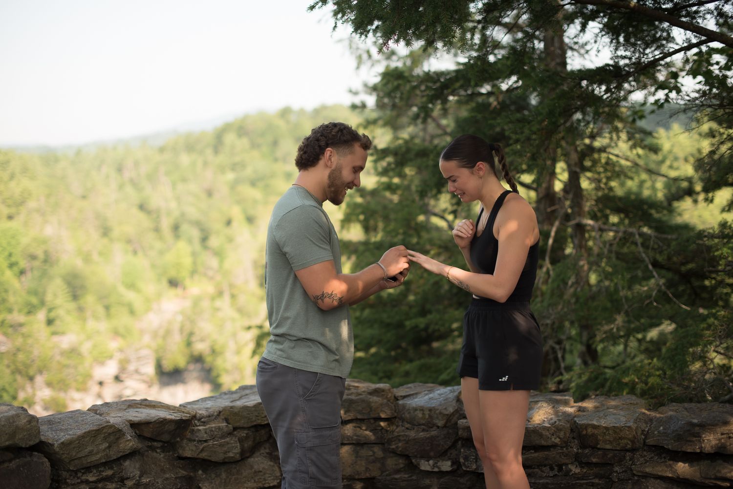 A coupe in the mountains just after a proposal