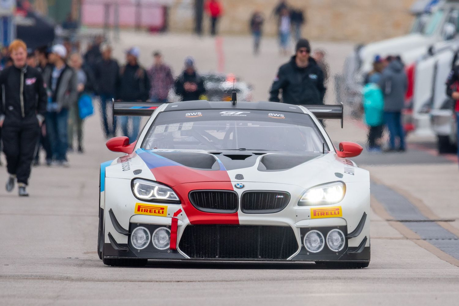Sleek sports cars lined up on display at an automotive event.