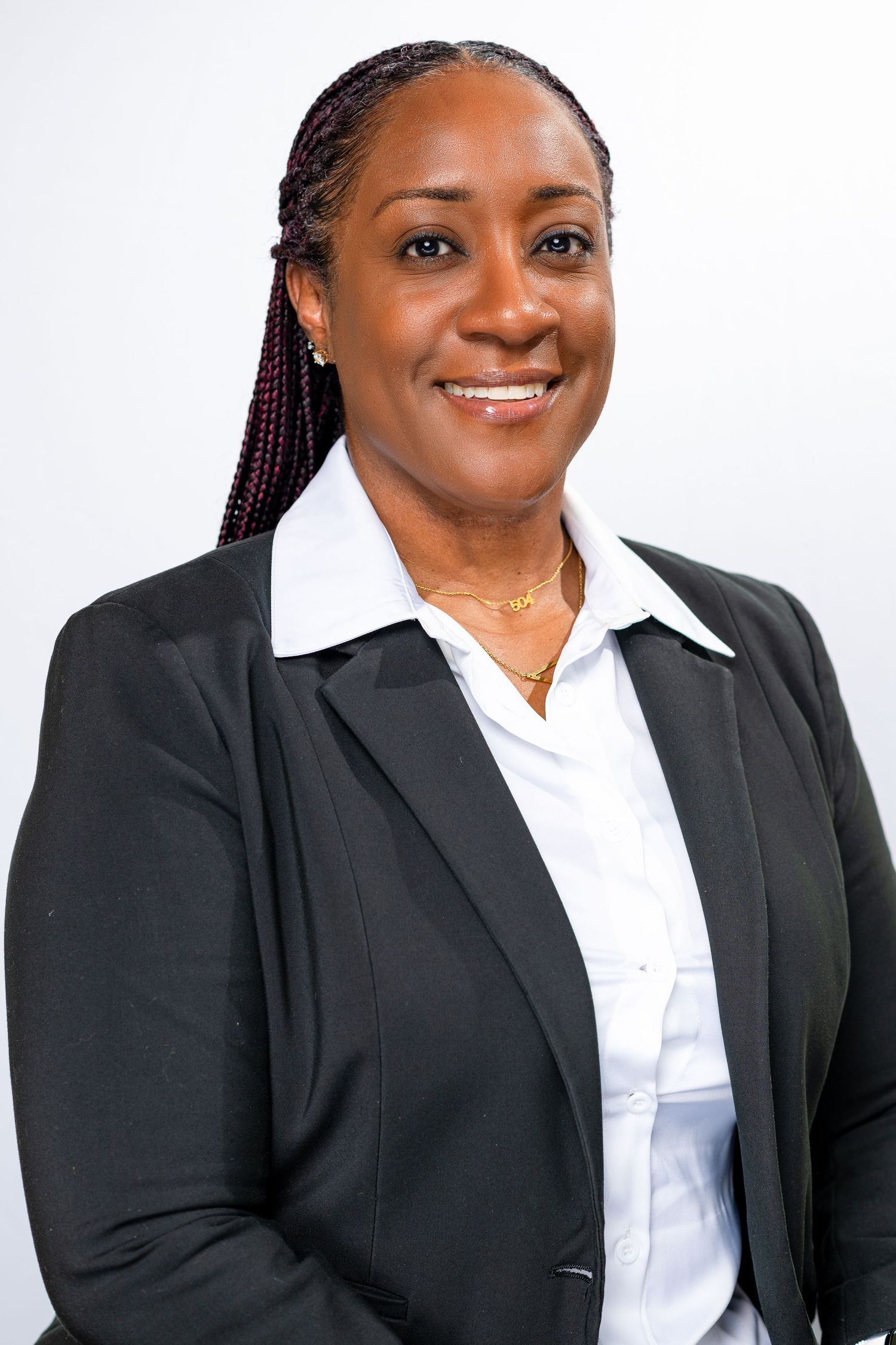 Business portraits featuring person in black suit jacket and white collared shirt.