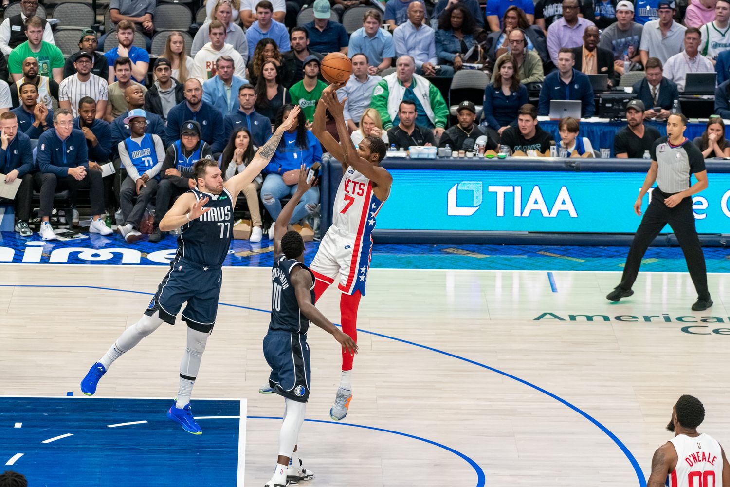 Wide shot of basketball court showing players in action during professional game.