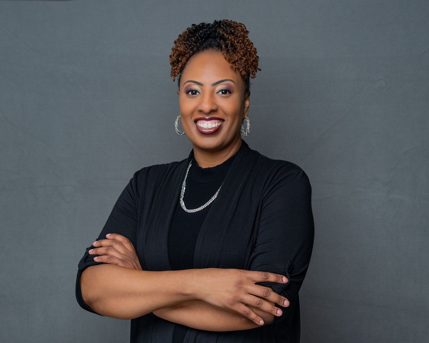 Series of professional headshots in black attire against grey studio background.