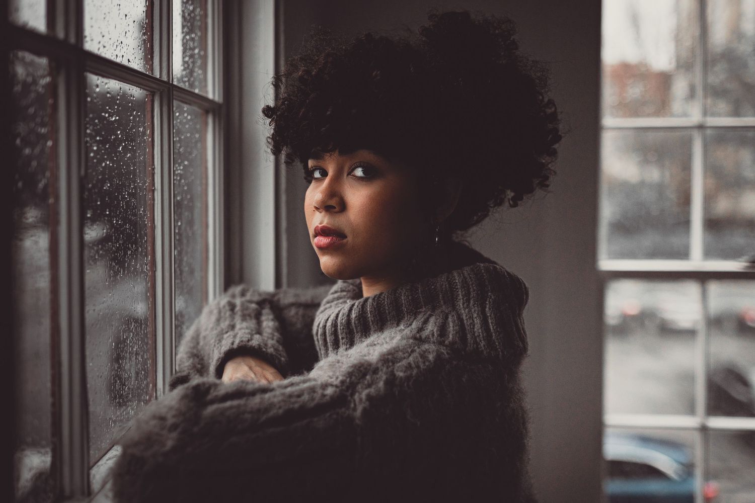 Savannah portrait photographer David Monroe —Atmospheric portraits by window with dramatic lighting and natural shadows.