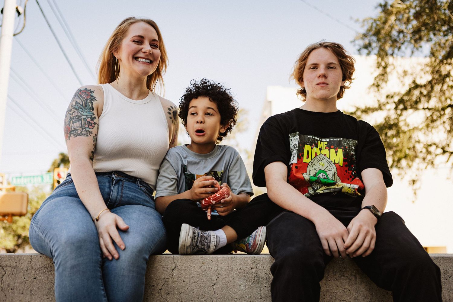 Savannah portrait photographer David Monroe —Family members sitting outdoors together engaging in casual conversation.