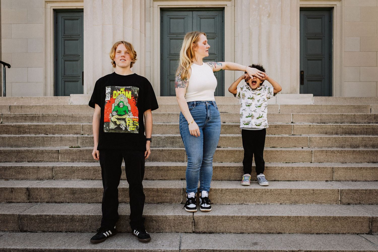 Savannah portrait photographer David Monroe —Row of legs and feet visible on stone steps with various casual clothing and shoes.