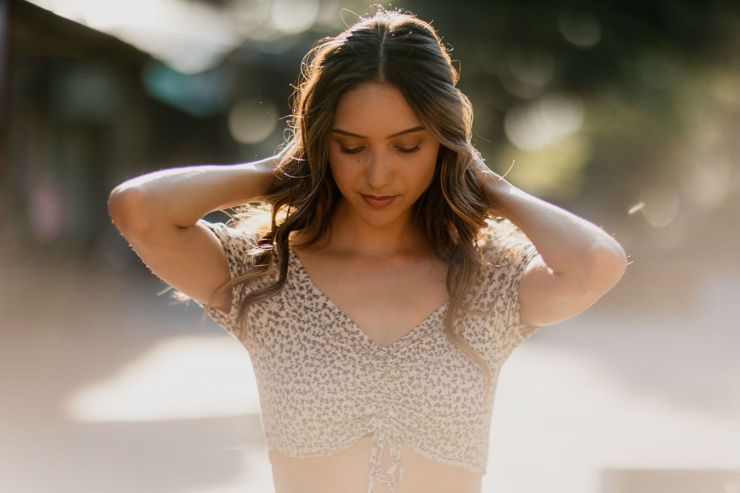 Artistic portrait with dreamy lighting and shallow depth of field creating a romantic mood.