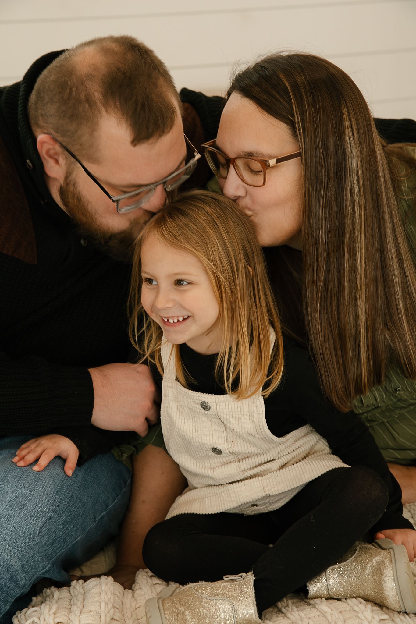 A series of candid photos showing tender embraces and emotional moments between family members indoor studio, elkton SD
