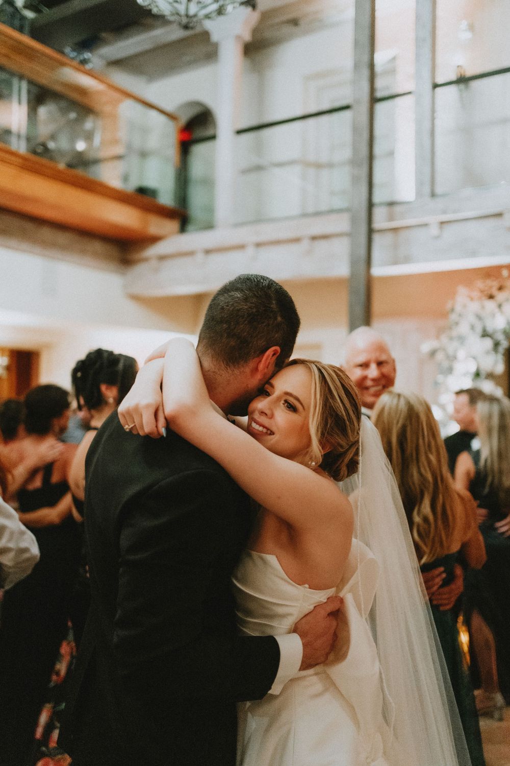 Couple sharing romantic dance moment at wedding reception.