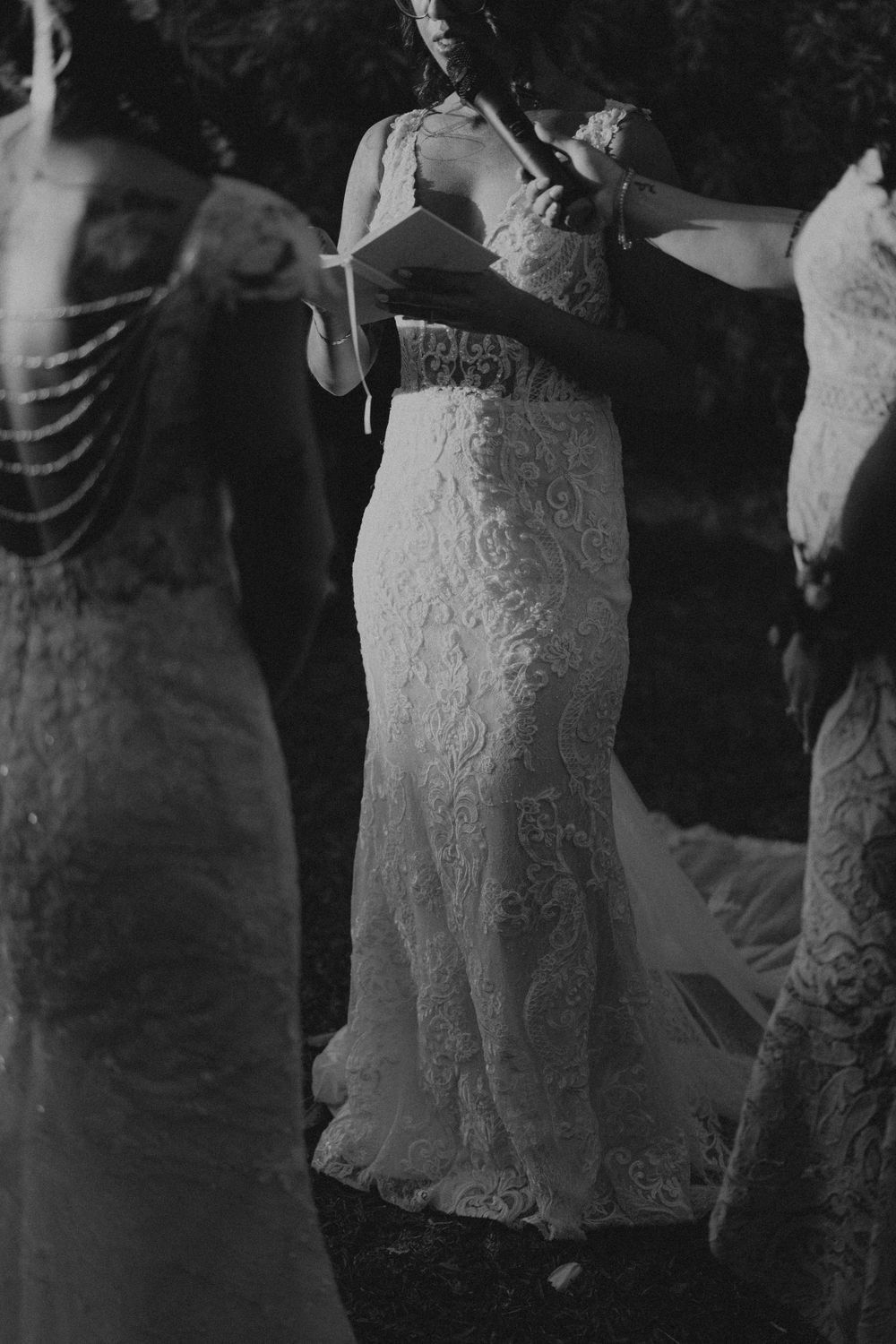 Black and white image of lace wedding dresses photographed in sequence.